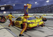 Joey Logano (22) makes a pit stop during the NASCAR Cup Series championship auto race at Homestead-Miami Speedway, Sunday, Nov. 18, 2018, in Homestead, Fla. (AP Photo/Lynne Sladky)