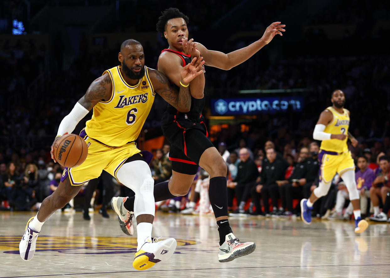 Los Angeles Lakers superstar LeBron James dribbles against Toronto Raptors forward Scottie Barnes during Barnes' rookie season. (Ronald Martinez/Getty Images)