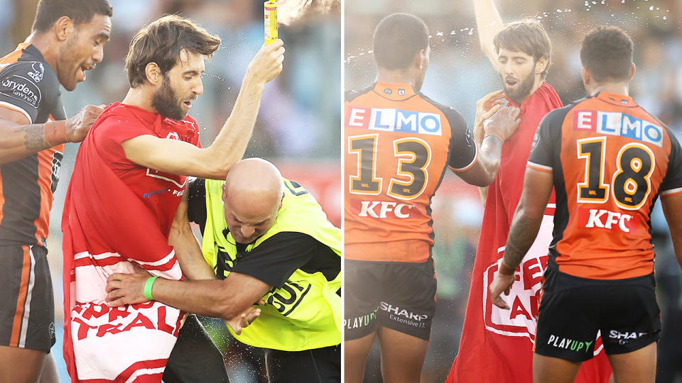 The pitch invader, pictured here running onto the field during the Wests Tigers' clash with the Sharks.