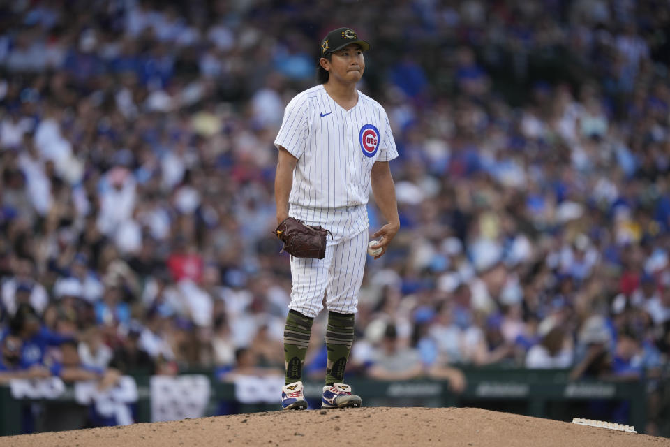 Chicago Cubs pitcher Shota Imanaga waits to pitch during the fourth inning of a baseball game against the Pittsburgh Pirates, Saturday, May 18, 2024, in Chicago. (AP Photo/Charles Rex Arbogast)