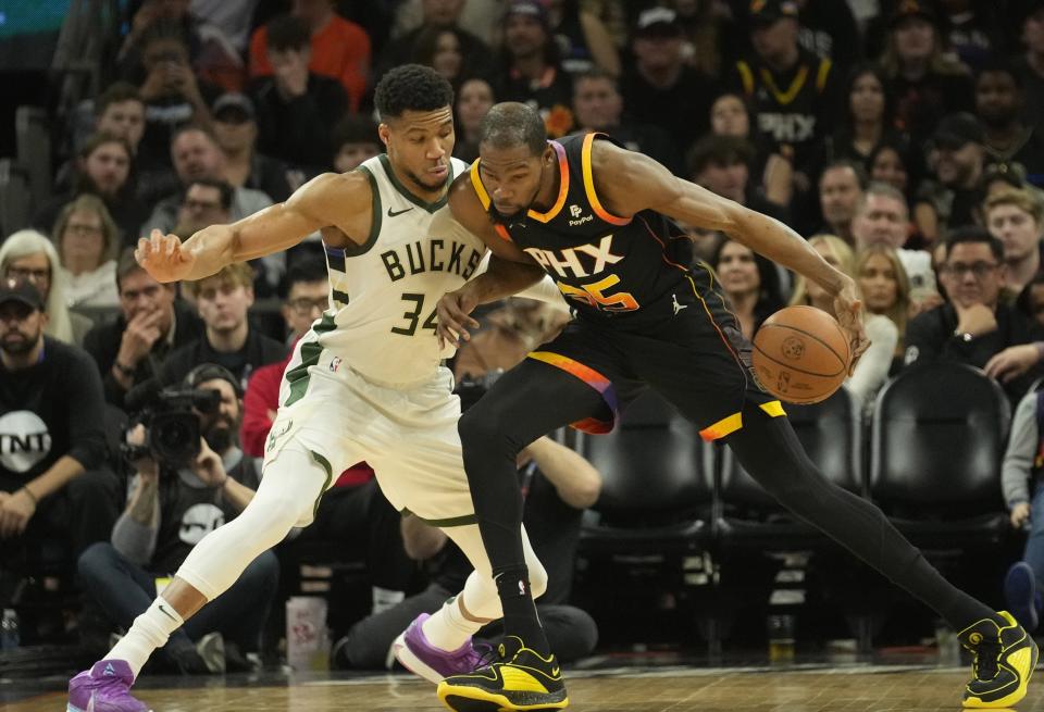 Phoenix Suns forward Kevin Durant (35) is defended by Milwaukee Bucks forward Giannis Antetokounmpo (34) during the second quarter at Footprint Center in Phoenix on Feb. 6, 2024.