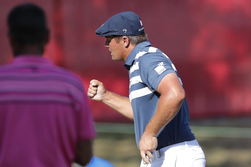 Bryson DeChambeau pumps his fist after his birdie putt on the 18th green during the final round of the Rocket Mortgage Classic golf tournament, Sunday, July 5, 2020, at Detroit Golf Club in Detroit. (AP Photo/Carlos Osorio)