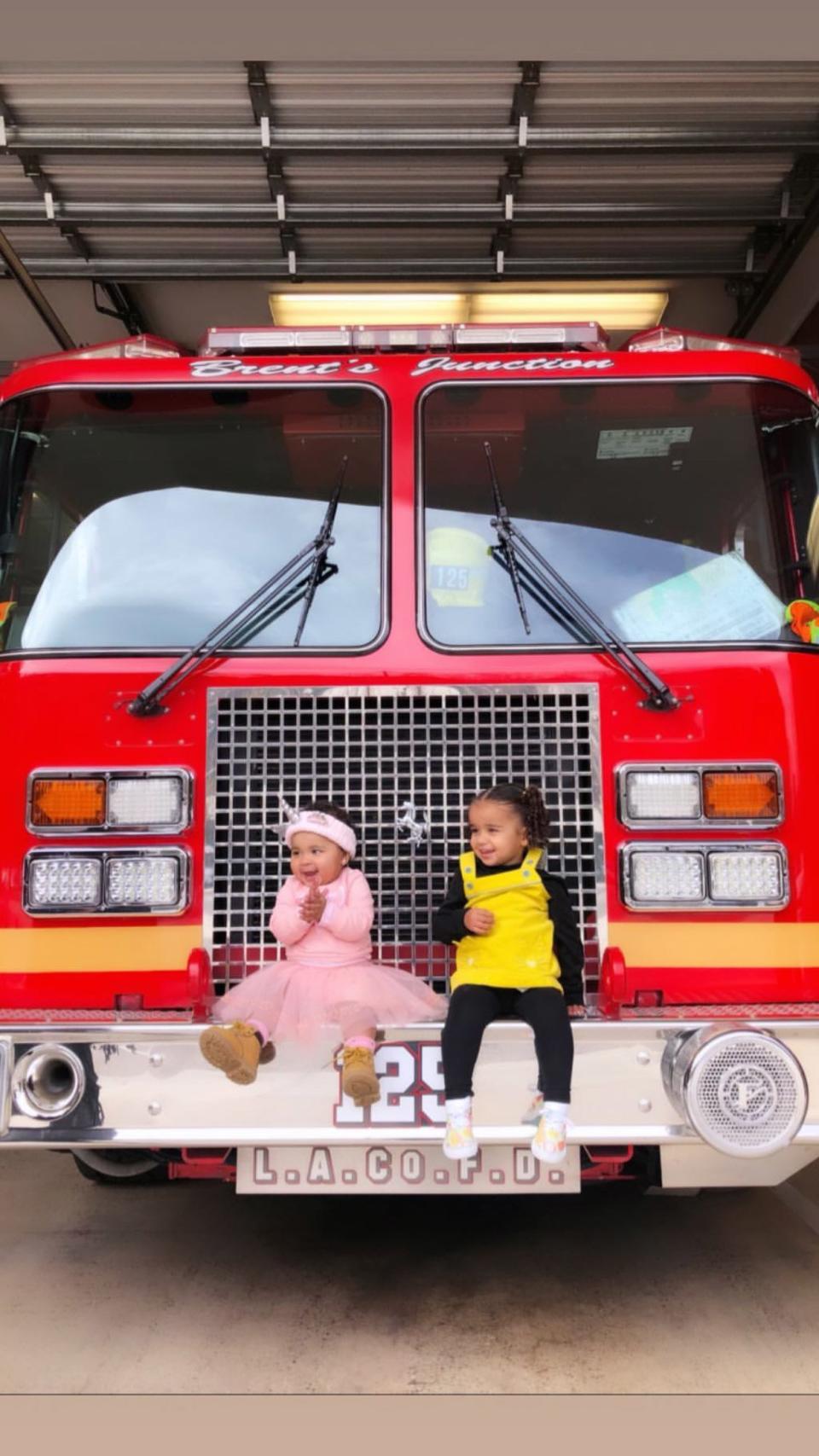 True and her cousin Dream couldn’t help but smile as the two got to sit on (and in!) a real fire truck <a href="https://people.com/parents/khloe-kardashian-takes-dream-true-fire-station-blac-chyna-rob-kardashian-drama/" rel="nofollow noopener" target="_blank" data-ylk="slk:during a visit;elm:context_link;itc:0;sec:content-canvas" class="link ">during a visit</a> to the Los Angeles County Fire Dept. Station 125 in Calabasas, California, with Khloé.