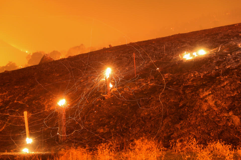 Flying embers from a destroyed fence are seen during the Kincade fire near Geyserville, California, U.S. October 24, 2019. (Photo: Stephen Lam/Reuters)