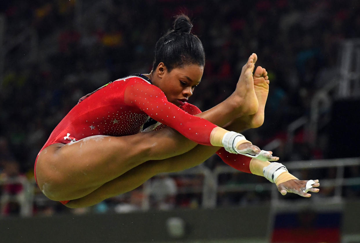 Aug 15, 2016; Rio de Janeiro, Brazil; Gabby Douglas (USA) during the women's uneven bars finals in the Rio 2016 Summer Olympic Games at Rio Olympic Arena. at Rio Olympic Arena. Mandatory Credit: Robert Deutsch-USA TODAY Sports