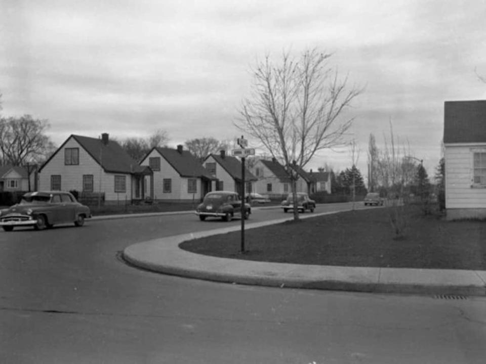 Cars drive through the northern part of the Carlington neighbourhood in this archival photo from 1956. Ottawa&#39;s planning committee has approved designating the post-Second World War community a &#39;character area&#39; to help preserve its built form. (City of Ottawa Archives - image credit)