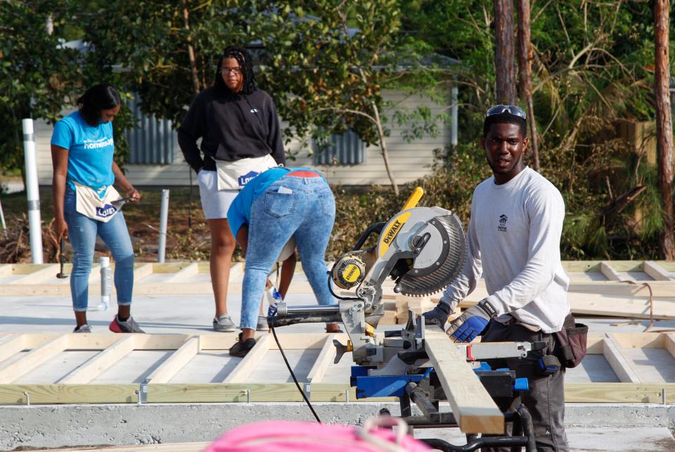 Volunteers work to build two homes side-by-side during Habitat for Humanity’s Women Build Day on Saturday, March 4, 2023, in Vero Beach. The event was created to empower women in the community by learning skills that encourage self-reliance while working as a team to raise the walls on the structures. The event began with a wall raising ceremony in a southwest Vero Beach neighborhood.  