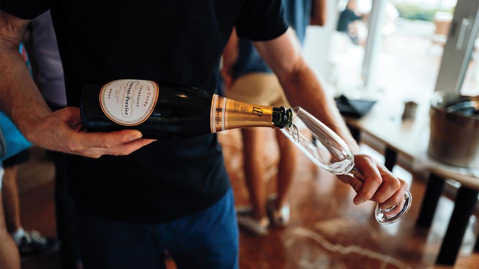 Pouring a post-ride glass of Champagne