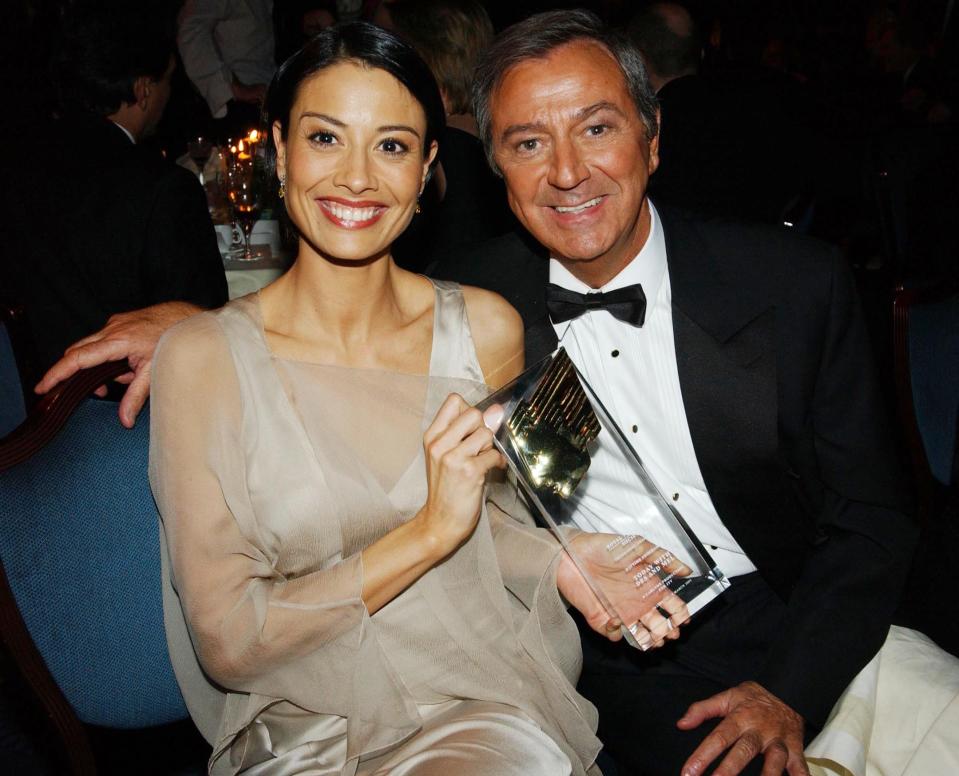 LONDON - MARCH 3: TV presenters Melanie Sykes and Des O'Connor at the Royal Television Society Programme Awards 2002 at the Grosvenor House Hotel, London on March 18, 2003. They present "Today With Des and Mel" which won an award for the best Daytime Programme. (Photo by Jon Furniss/Getty Images)