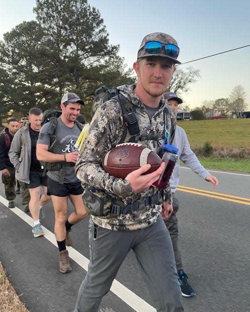 University of Alabama senior Grant Gillenwater carries a football on day 3 of the Iron Ruck