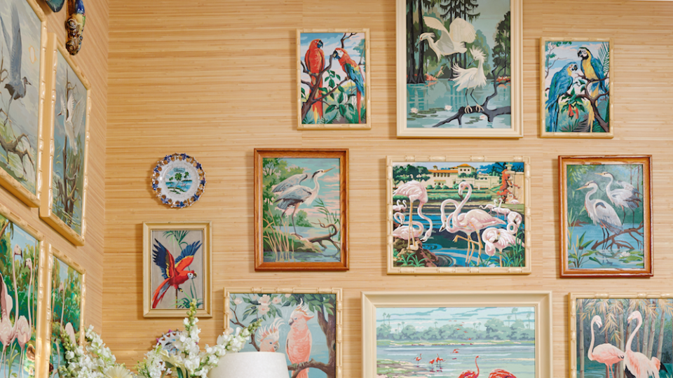 tropical bird paintings in a tropical decorated room