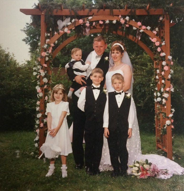 Cindy Krantz appears in a family photo with her husband, Christopher Krantz, and her children.