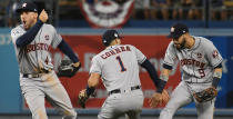 <p>Houston Astros left fielder Marwin Gonzalez (9) and shortstop Carlos Correa (1) and center fielder George Springer (4) celebrate after defeating the Los Angeles Dodgers in eleven innings in game two of the 2017 World Series at Dodger Stadium. Mandatory Credit: Richard Mackson-USA TODAY Sports </p>