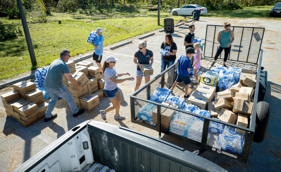 Better Together helped with recovery efforts after Hurricane Ian by handing out water.