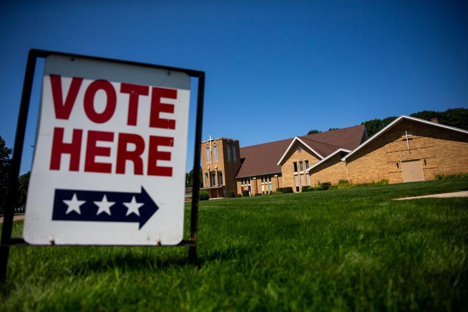 A large vote here sign sits outside the polling location during the primary election Tuesday, Aug. 2, 2022, at Rose Park Reformed Church in Holland. 