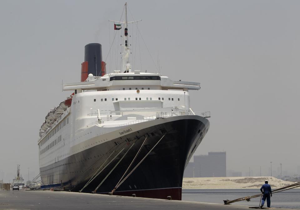 The Queen Elizabeth 2 is seen at dock as Istithmar World, the Dubai state investment company that owns the ship, outlined plans Monday to turn the retired cruise liner into a 300-room hotel, ending years of speculation about its fate, in Port Rashid, Dubai, United Arab Emirates, Monday, July 2, 2012. Britain's Queen Elizabeth II launched the QE2 in 1967. (AP Photo/Kamran Jebreili)