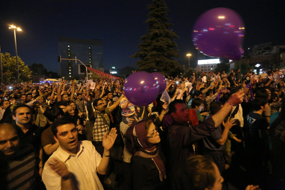 Iranians gather to celebrate the victory of moderate presidential candidate Hassan Rouhani in the presidential elections at Vanak Square, in northern Tehran, on June 15, 2013. (ATTA KENARE/AFP/Getty Images)