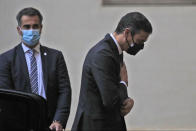 Spain's Prime Minister Pedro Sanchez, right, arrives at the San Damaso courtyard to meet Pope Francis, at the Vatican, Saturday, Oct. 24, 2020. (AP Photo/Alessandra Tarantino)