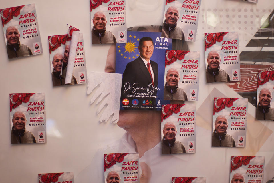 Stickers of ATA Alliance presidential candidate Sinan Ogan, center in blue, and coalition partner Umit Ozdag cover a street billboard of Turkish President and People's Alliance's presidential candidate Recep Tayyip Erdogan in Istanbul, Turkey, Monday, May 8, 2023. Turkey is heading toward presidential and parliamentary elections on Sunday May 14, 2023. (AP Photo/Francisco Seco)
