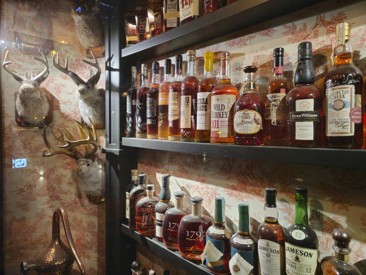 A collection of bottles of whiskies and Kentucky bourbons are displayed at "Seven Grand," a whiskey bar downtown Los Angeles Saturday, March 4, 2023. Seven Grand offers an extensive selection of over 700 different whiskies from around the world, including rare and hard-to-find bottles. (AP Photo/Damian Dovarganes)