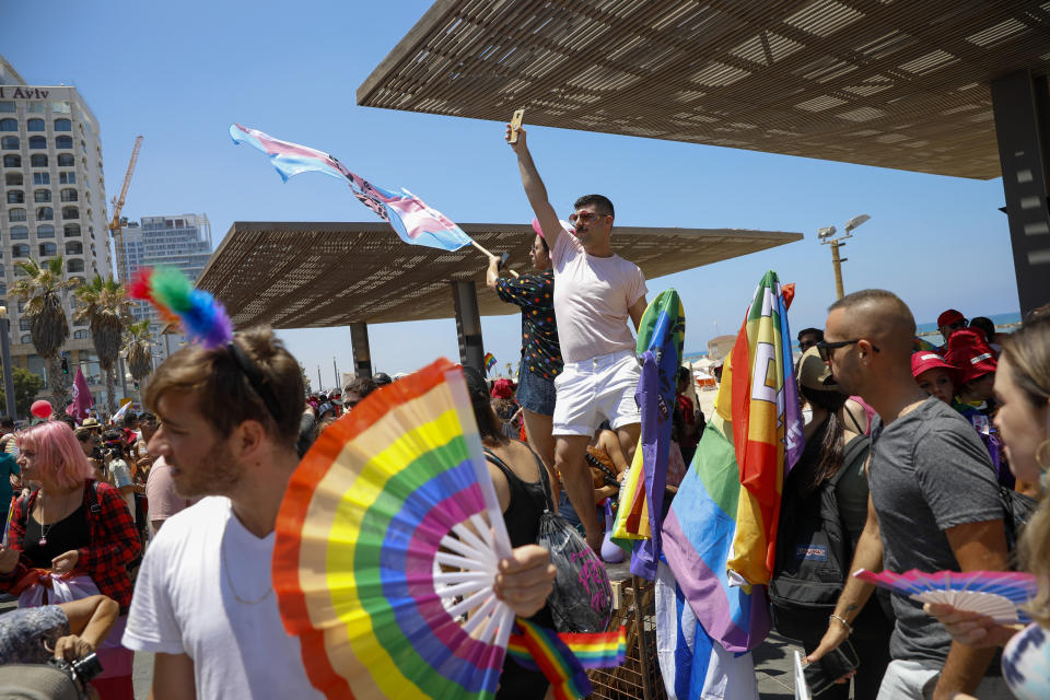 People participate in the annual Pride Parade, in Tel Aviv, Israel, Friday, June 25, 2021. Thousands of people attended the parade in one of the largest public gatherings held in Israel since the onset of the coronavirus pandemic. (AP Photo/Ariel Schalit)