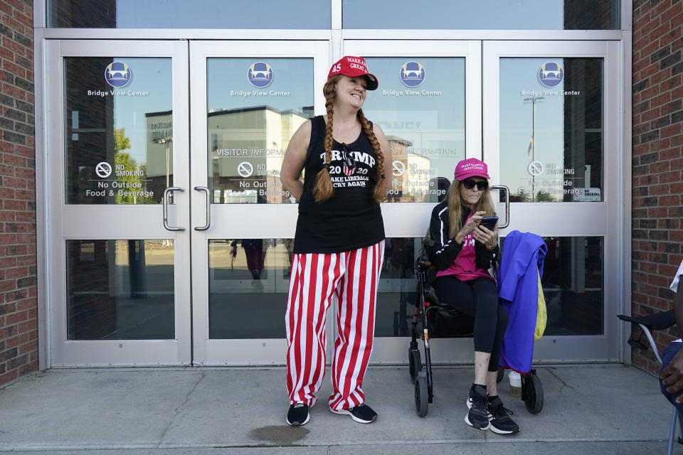 Jaimi Fay, and her mom Kimberly Fay, both of Omaha, Neb., wait in line to listen to former President Donald Trump speak at a rally, Sunday, Oct. 1, 2023, in Ottumwa, Iowa. (AP Photo/Charlie Neibergall)