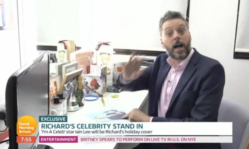 I’m A Celeb’s Iain Lee popped up to say hi, after the news. (Credit: ITV)