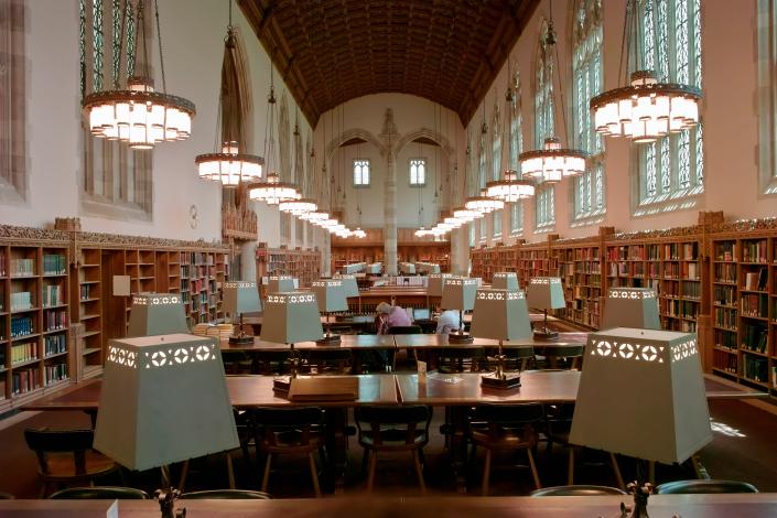 If the kitchen is the heart of the home, the library is the soul of a university, and Sterling Library, one of Yale University’s most prominent buildings, is proof. Completed in 1930 by alumna James Gamble Rogers, who graduated in 1889, the classic collegiate Gothic-style space houses nearly three million volumes spread across 14 floors of book stacks. Named for its benefactor, John William Sterling, who graduated from Yale in 1864, the library leans toward the drama with a 60-foot ceiling, cloisters, clerestory windows, side chapels, and a circulation desk altar. Not to mention, there are 3,300 stained glass windows designed by artist G. Owen Bonawit throughout the entire space.