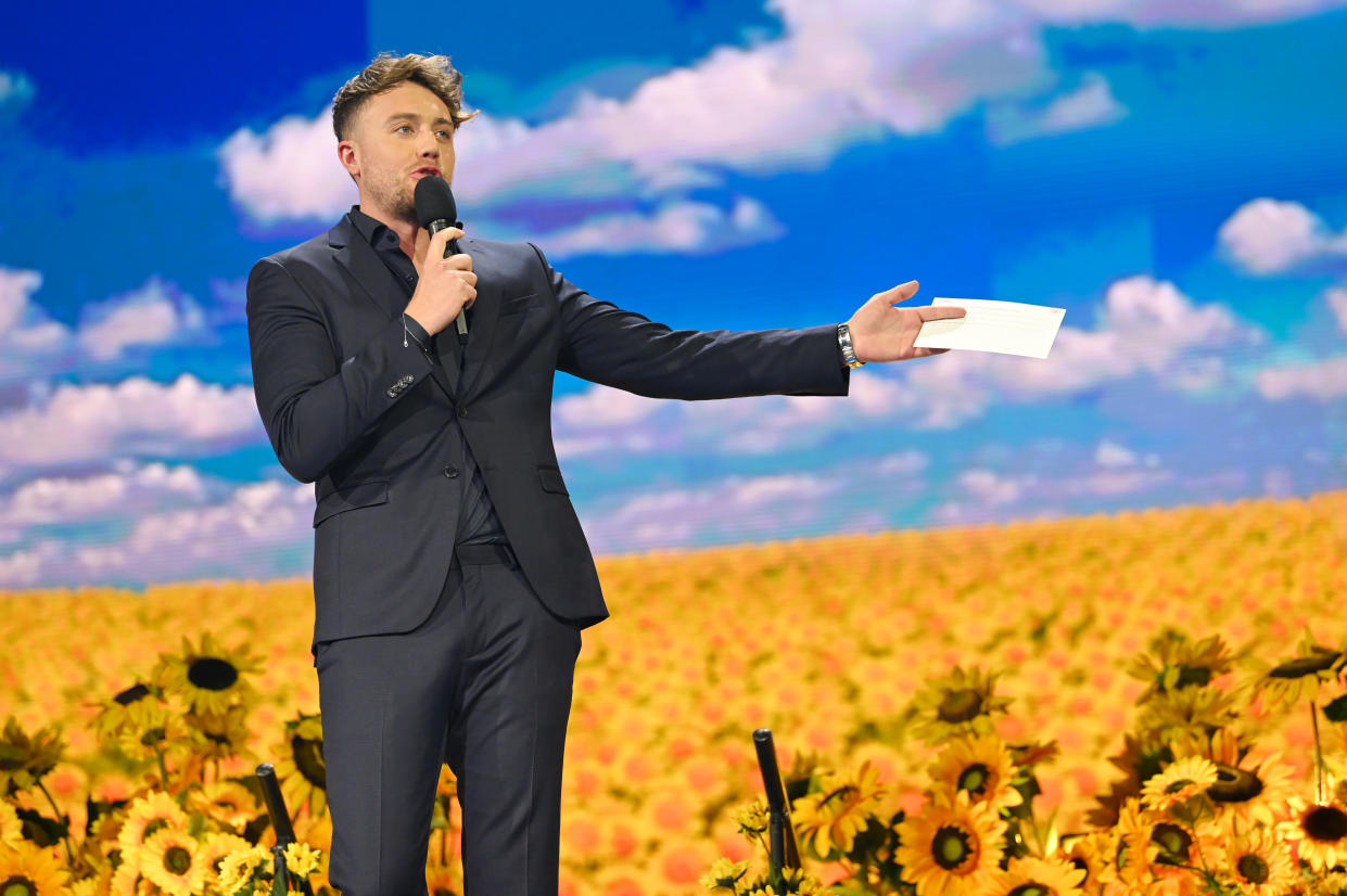 BIRMINGHAM, ENGLAND - MARCH 29: Presenter Roman Kemp during a Concert for Ukraine at Resorts World Arena on March 29, 2022 in Birmingham, England. All proceeds from Concert for Ukraine are being donated to Disasters Emergency Committee's Ukraine Humanitarian Appeal. (Photo by Joe Maher/Disasters Emergency Committee/Getty Images for Livewire Pictures Ltd)