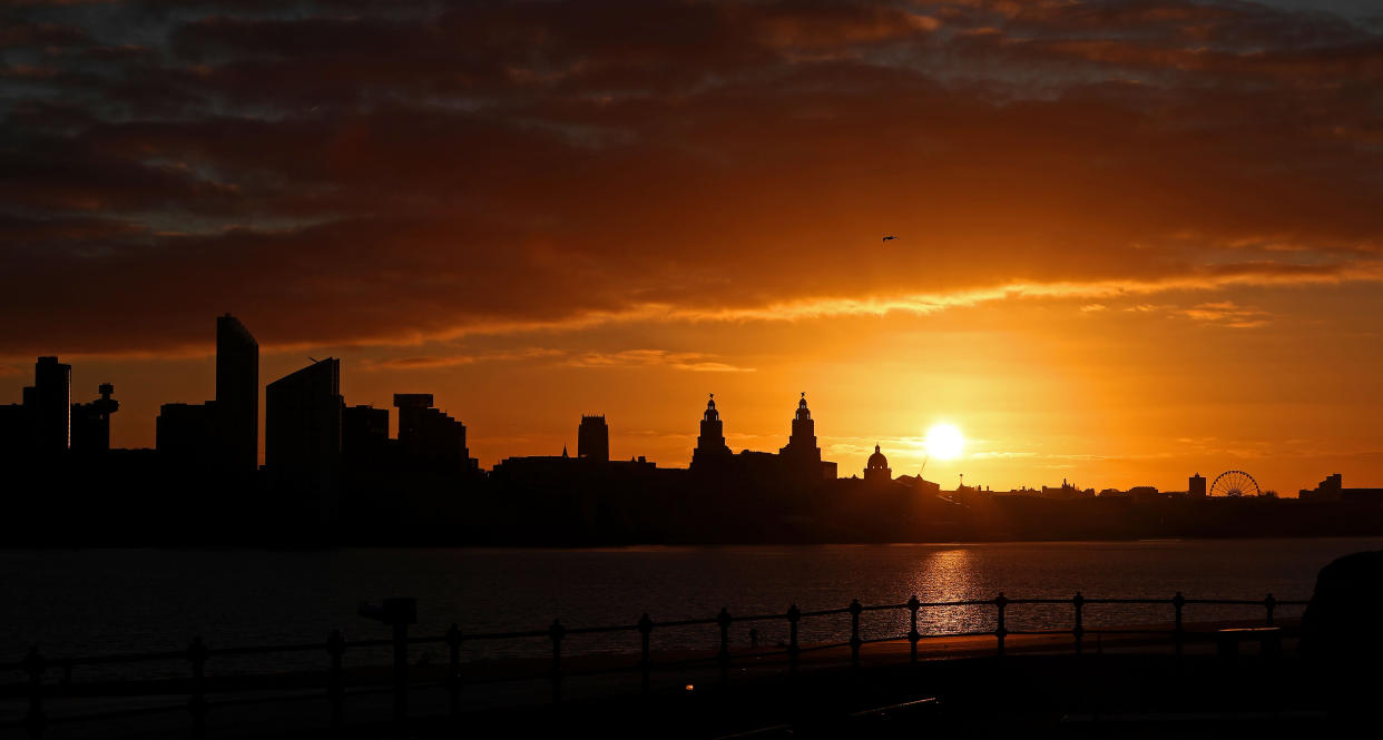 The sun rises behind the Liver Building over the Liverpool waterfront as temperatures dropped below freezing for many parts of the country.