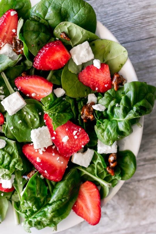 <p>Sweet Tea and Thyme</p><p>Strawberry spinach salad is this salad hater's favorite salad! Delicious and classic with juicy strawberries, creamy feta cheese and crunchy candied nuts with a bright lemon poppyseed dressing!</p><p><strong>Get the Recipe: </strong><a href="https://www.sweetteaandthyme.com/strawberry-spinach-salad-melting-pot/" rel="nofollow noopener" target="_blank" data-ylk="slk:Strawberry Spinach Salad;elm:context_link;itc:0;sec:content-canvas" class="link "><strong>Strawberry Spinach Salad</strong></a></p>