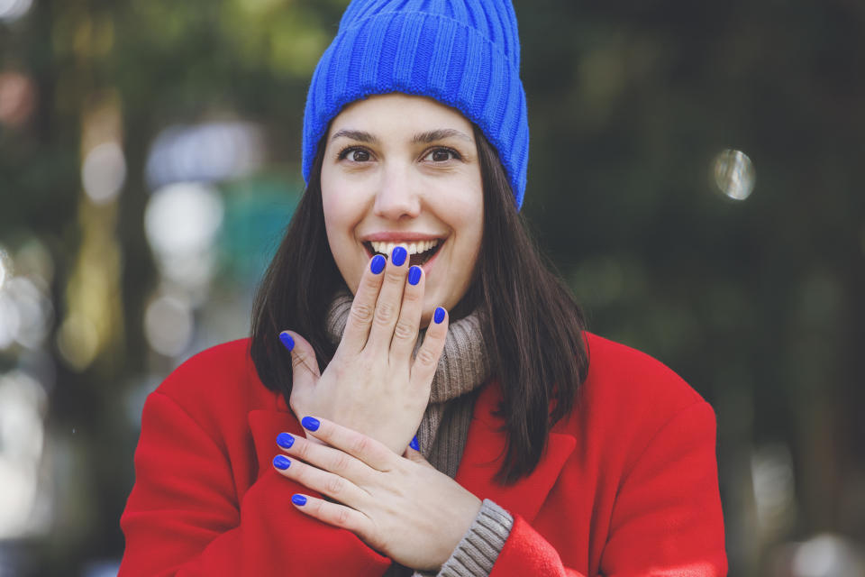 Woman with cobalt blue nails