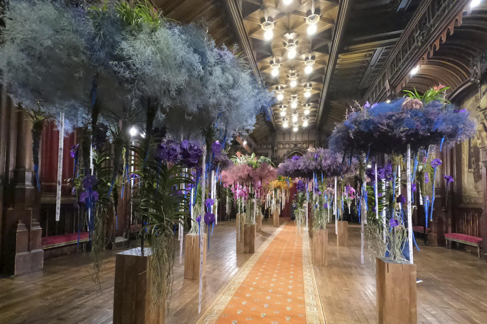 Fairyland style trees made of flowers inside City Hall, Brussels, Belgium, Friday Aug. 11, 2023. Belgium has a century-old fling with surrealism and is always proud to flaunt it. This year they're combining it with an annual flower show in Brussels. (AP Photo/Mark Carlson)