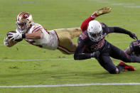 San Francisco 49ers tight end George Kittle (85) is tackled short of the goal line by Arizona Cardinals safety Deionte Thompson (35) during the first half of an NFL football game, Thursday, Oct. 31, 2019, in Glendale, Ariz. (AP Photo/Rick Scuteri)