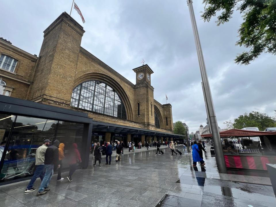 The exterior of King's Cross Train Station in London on a rainy day