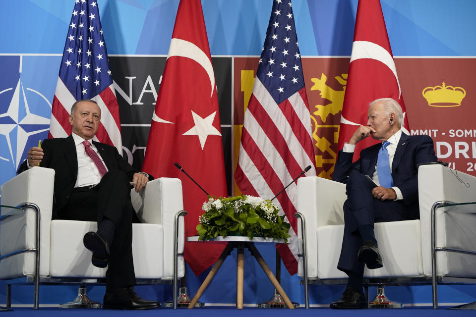 FILE - President Joe Biden, right, meets with Turkey's President Recep Tayyip Erdogan, left, during the NATO summit in Madrid, June 29, 2022. Turkey and the United States will aim to smooth out a series of disagreements between the NATO allies when Turkey's foreign minister visits this week but expectations that outstanding issues can be resolved are slim. (AP Photo/Susan Walsh, File)