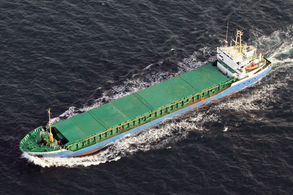 DOVER, ENGLAND - APRIL 07:  A cargo ship is seen from the air in the English Channel on April 7, 2011 in Dover, England. The chalk cliffs, which stand over 100 metres high, represent the closest point between England and mainland Europe.  (Photo by Oli Scarff/Getty Images)