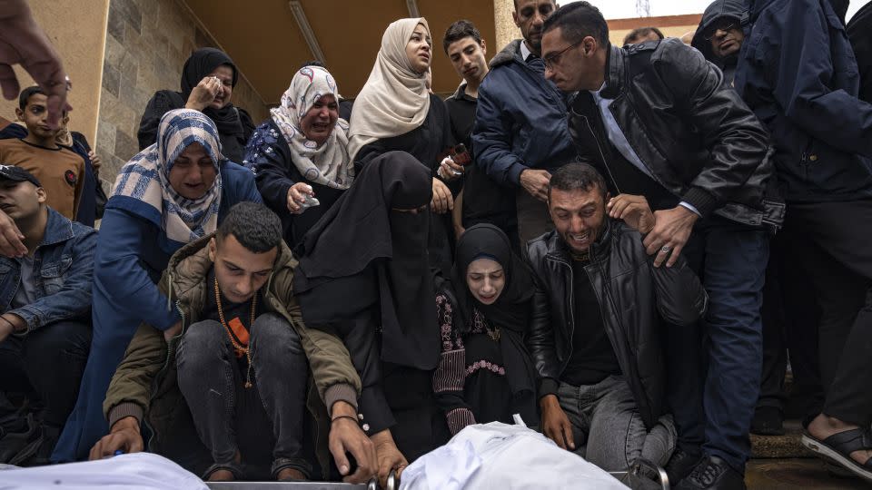Palestinians mourn relatives killed in the Israeli bombardment of Gaza, at the hospital in Khan Younis on November 15. - Fatima Shbair/AP