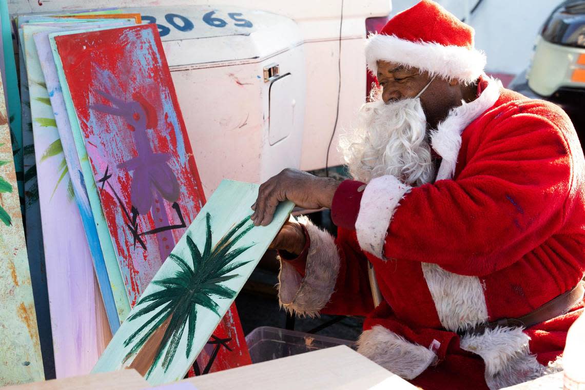 Ernest Lee sells his famous Chicken Man and other paintings on Gervais Street on Friday, December 15, 2022. Lee’s artwork is widely collected, and some collectors give the paintings as gifts.