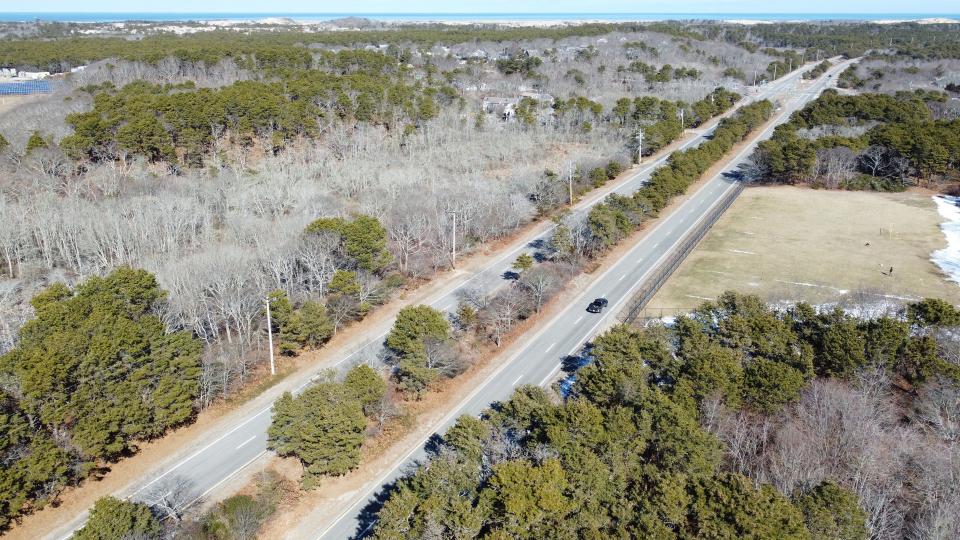 A dedicated bike and pedestrian path along Route 6 from the Truro town line to Herring Cove Beach in Provincetown is envisioned in proposals to be discussed at a public forum on March 18 in Provincetown. In the photograph from Thursday is an aerial view of Route 6 in Provincetown in the area of a proposed multi-use path.