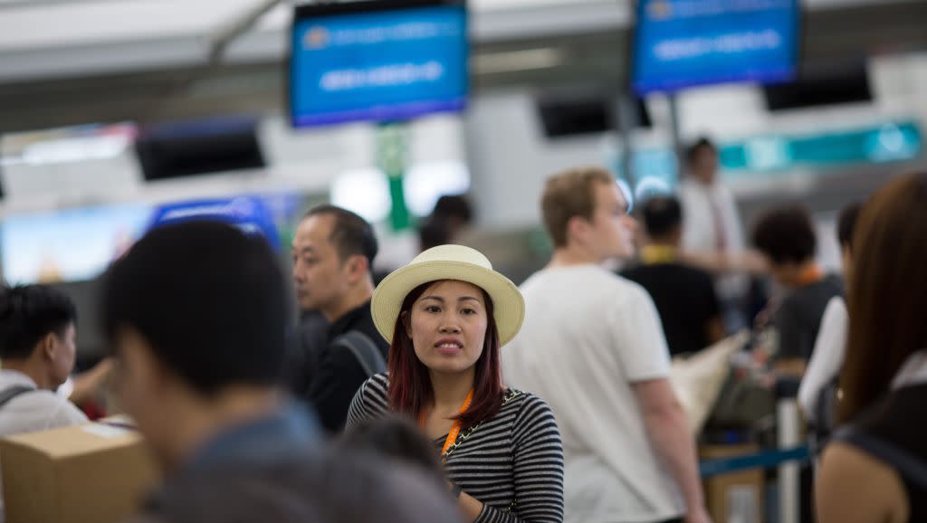 Passengers line up to check-in at Hong Kong International Airport in Hong Kong, China, 11 October 2016. In September the Airport Authority secured a 50-year land lease to develop retail, dining and entertainment hub. EPA/JEROME FAVRE