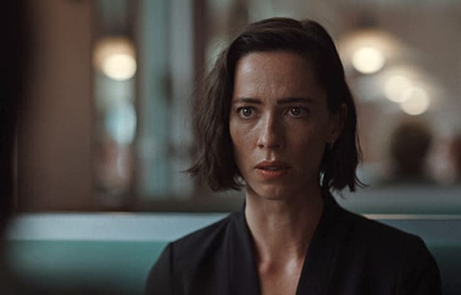 Rebecca Hall looks at camera in Resurrection film