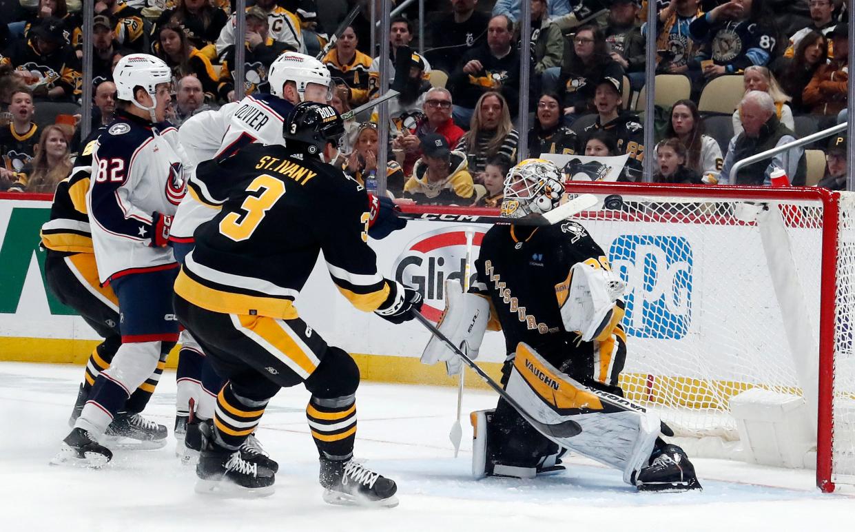 Mar 28, 2024; Pittsburgh, Pennsylvania, USA; Columbus Blue Jackets right wing Mathieu Olivier (24) tips the puck past Pittsburgh Penguins goaltender Alex Nedeljkovic (39) for a goal during the second period at PPG Paints Arena. Mandatory Credit: Charles LeClaire-USA TODAY Sports