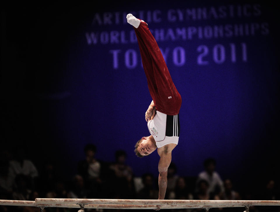 Jonathan Horton of the USA competes on the Parallel Bars apparatus in the Men's qualification during the Artistic Gymnastics World Championships Tokyo 2011 at Tokyo Metropolitan Gymnasium on October 9, 2011 in Tokyo, Japan. (Photo by Adam Pretty/Getty Images)