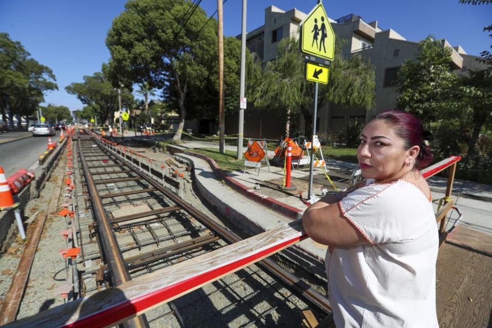 Idalia Rios, a Santa Ana Lacy resident and volunteer, near the construction.