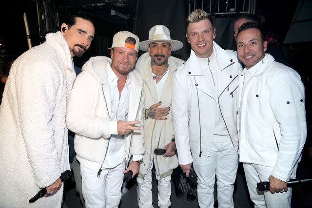 <p>Kevin Mazur/Getty </p> Kevin Richardson, Brian Littrell, AJ McLean, Nick Carter and Howie Dorough of the Backstreet Boys attend an iHeartRadio event in 2022.