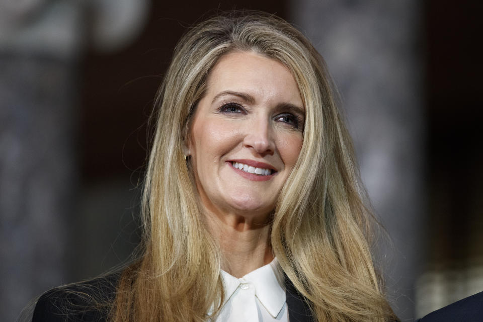 Sen. Kelly Loeffler, R-Ga., smiles before a re-enactment of her swearing-in, Monday Jan. 6, 2020, by Vice President Mike Pence on Capitol Hill in Washington. (AP Photo/Jacquelyn Martin)