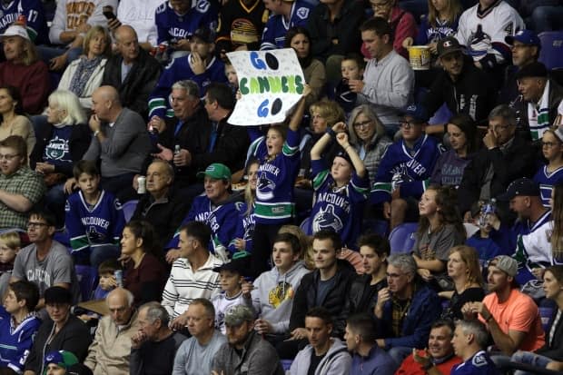Vancouver Canucks fans cheer on their team during a pre-season game against the Calgary Flames on Sept. 16, 2019.  (Chad Hipolito/The Canadian Press - image credit)