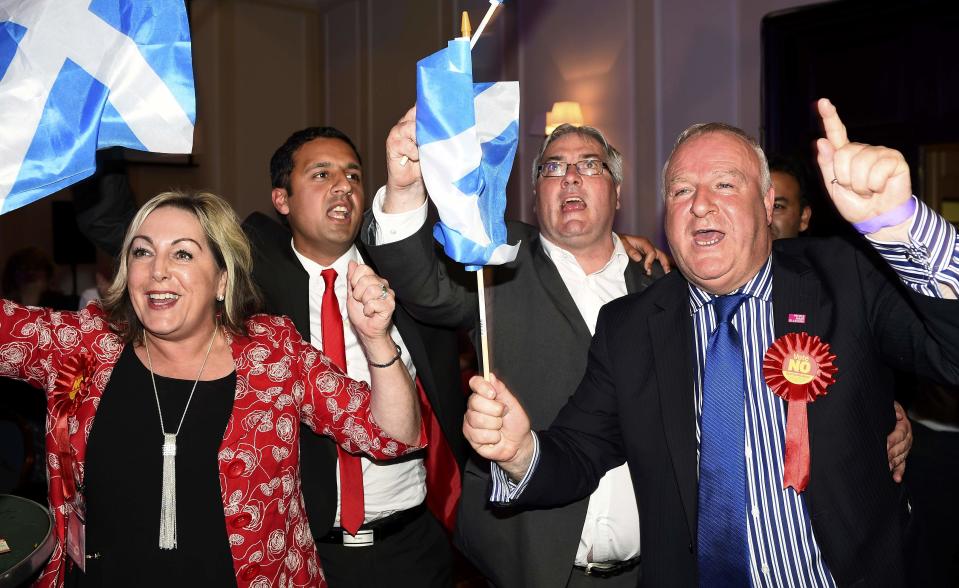 Supporters from the "No" Campaign celebrate at the Better Together Campaign headquarters in Glasgow, Scotland