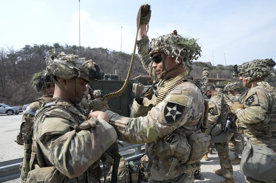 U.S. Army soldiers prepare to participate in a combined live fire exercise between South Korea and the United States at Rodriguez Live Fire Complex in Pocheon, South Korea, Wednesday, March 22, 2023. North Korea launched multiple cruise missiles toward the sea on Wednesday, South Korea's military said, three days after the North carried out what it called a simulated nuclear attack on South Korea. (AP Photo/Ahn Young-joon)